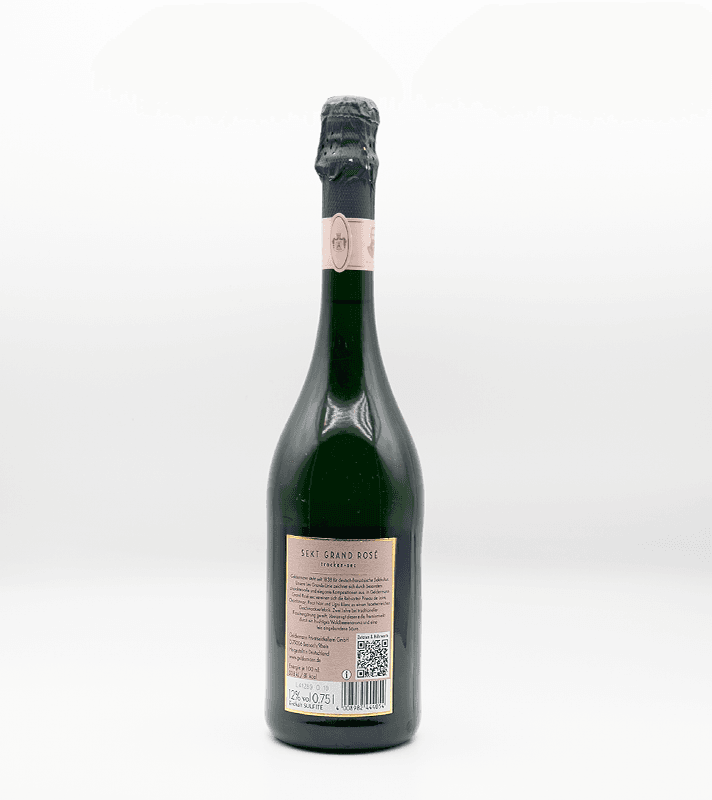 Grüne Flasche mit rosafarbenem Etikett und schwarzem Korkverschluss, vermutlich Sekt oder Champagner, mit Barcode und QR-Code auf der Rückseite.