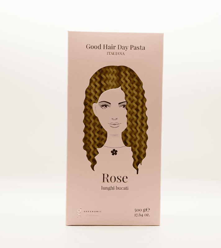 Verpackung mit braunen, gewellten Haar-Extensions, auf einer rosa Box mit Illustration eines Gesichts und Texten: "Good Hair Day Pasta", "Rose", "lunghi bucat" und Produktangaben.