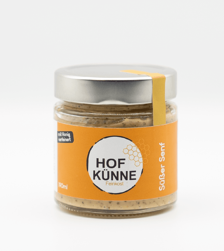 Glas jar mit Honig-Feinkost, orange Etikett, silberner Deckel, gelbe Band, enthält süßen Honig mit Honigwaben-Optik.