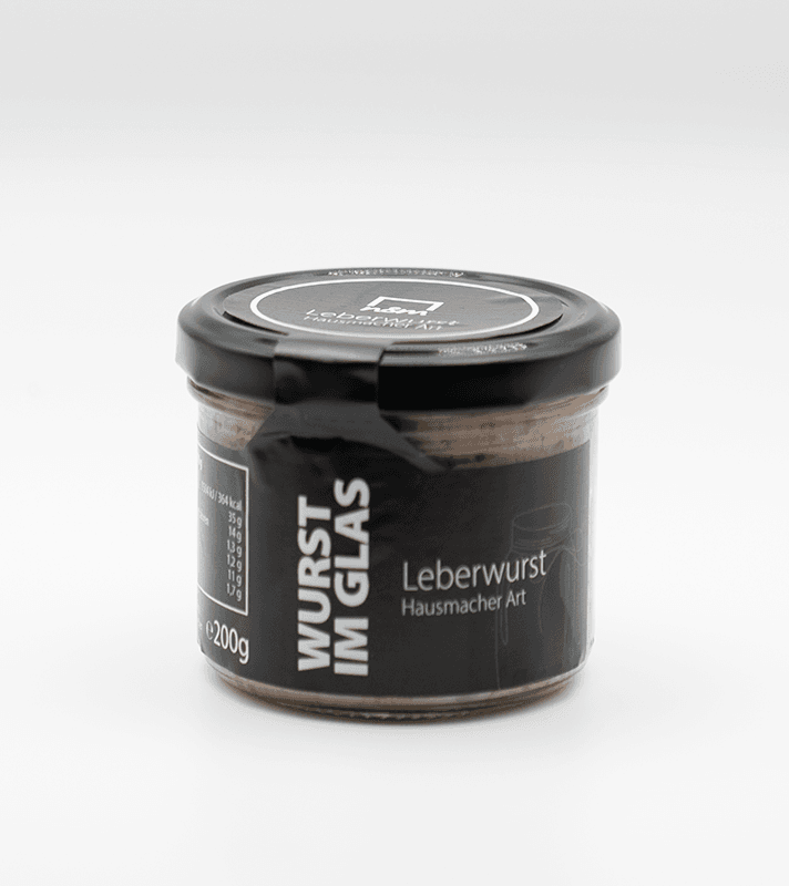 Dosen mit Leberwurst in schwarzer Verpackung, beschriftet mit "Wurst im Glas" und "Leberwurst Hausmacher Art", auf weißem Hintergrund.