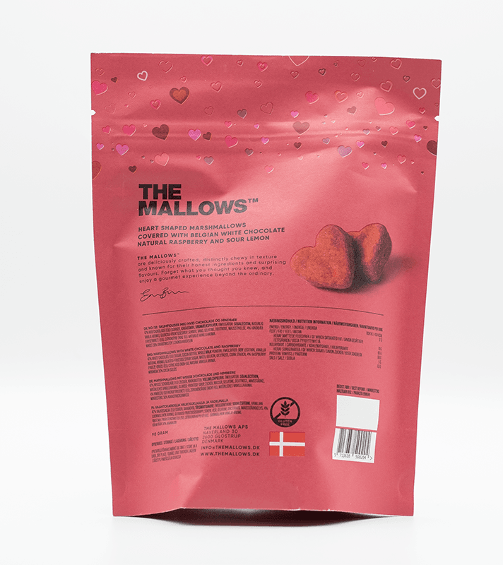 Pink Verpackung mit Herzmotiven, zeigt zwei herzförmige Schaumküsse, enthält belgische weiße Schokolade, Himbeere und Zitrone, glutenfrei, 90 g.